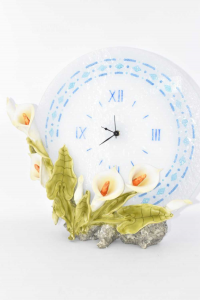 Glass Clock With Calla Lilies In Wood Pulp And Lamp In Back Hermes Design