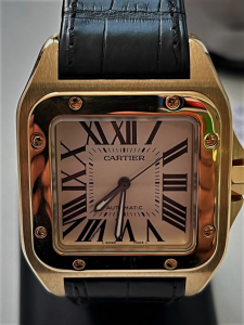Orologio secondo polso Cartier Santos 100XL in oro giallo 